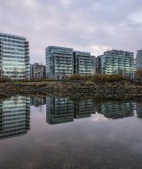 Beautiful view of apartment buildings in False Creek, Downtown Vancouver, BC, Canada. Picture taken during a cloudy sunrise.